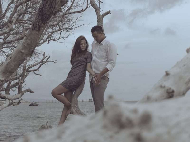 A couple under a dry tree, Balinese photography
