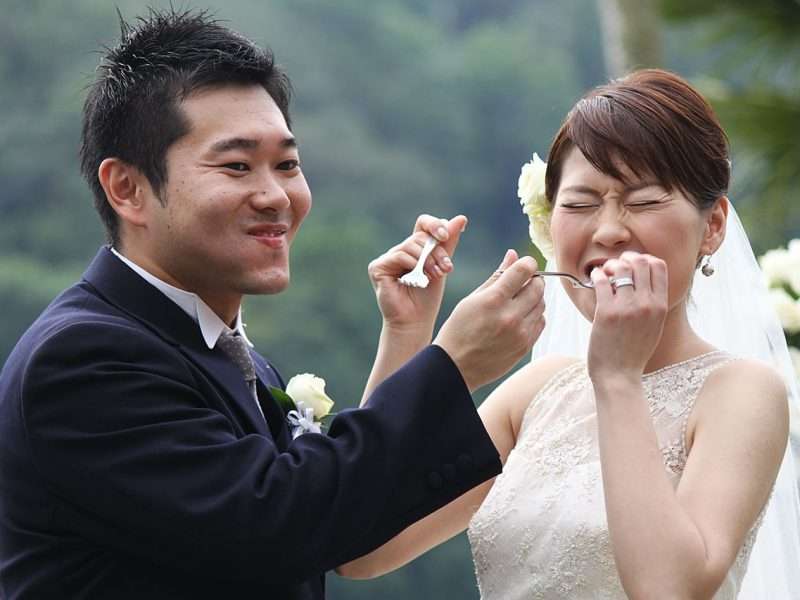 A couple eating their cake